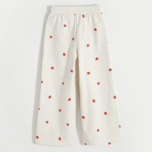                             Teplákové kalhoty s jahodami -krémové                        
