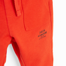                             Teplákové kalhoty s nápisem -červené                        