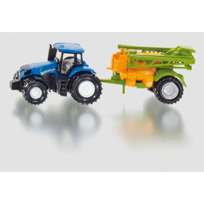Traktor s přívěsem na rozprašování hnojiva